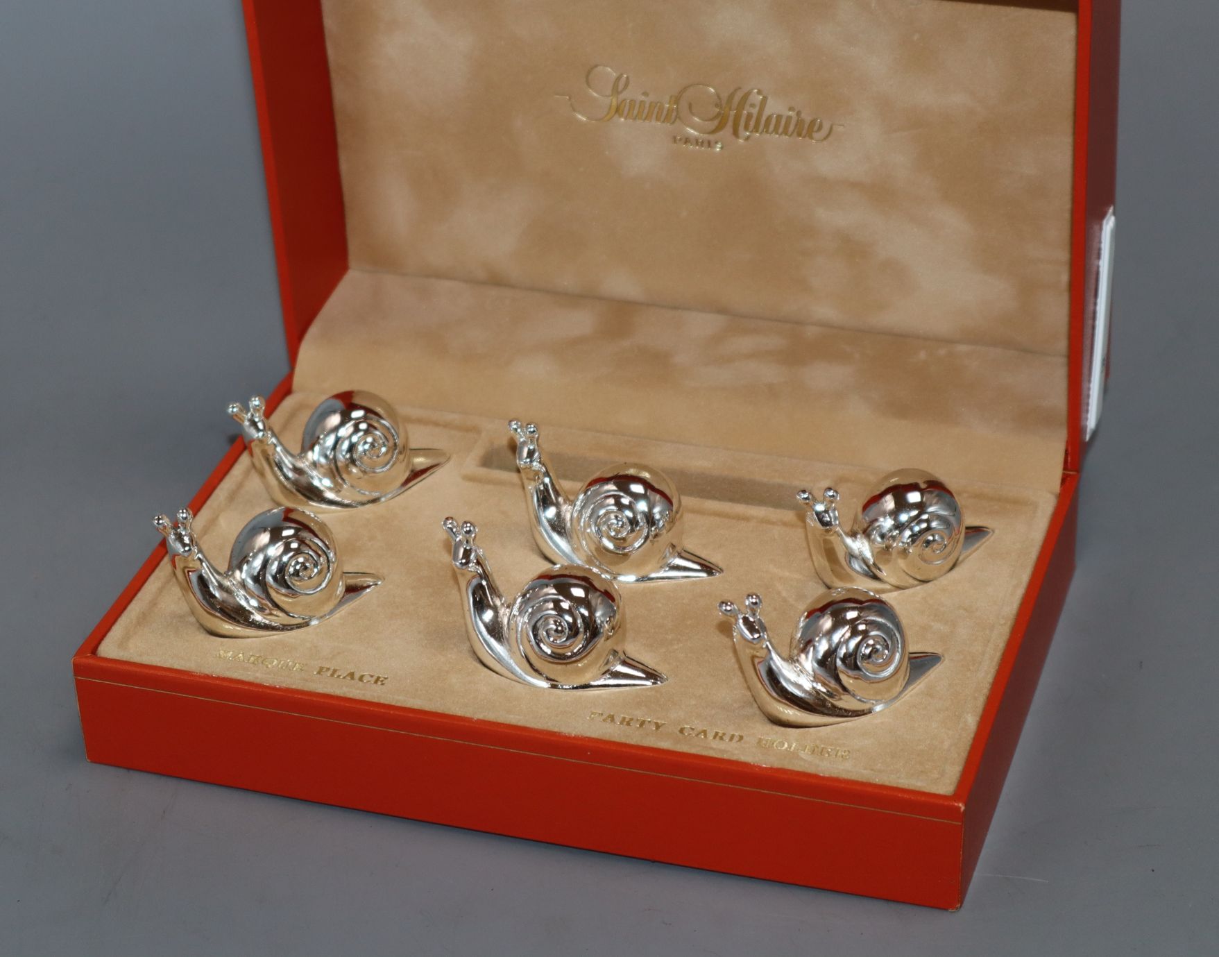 A set of eight plated card holders modelled as snails by Saint Hilaire (in three boxes)