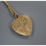A 9ct gold heart-shaped locket on fancy gold chain (tests as 14ct).