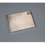 A George V engine turned silver cigarette case, Birmingham, 1930, 11.7cm.