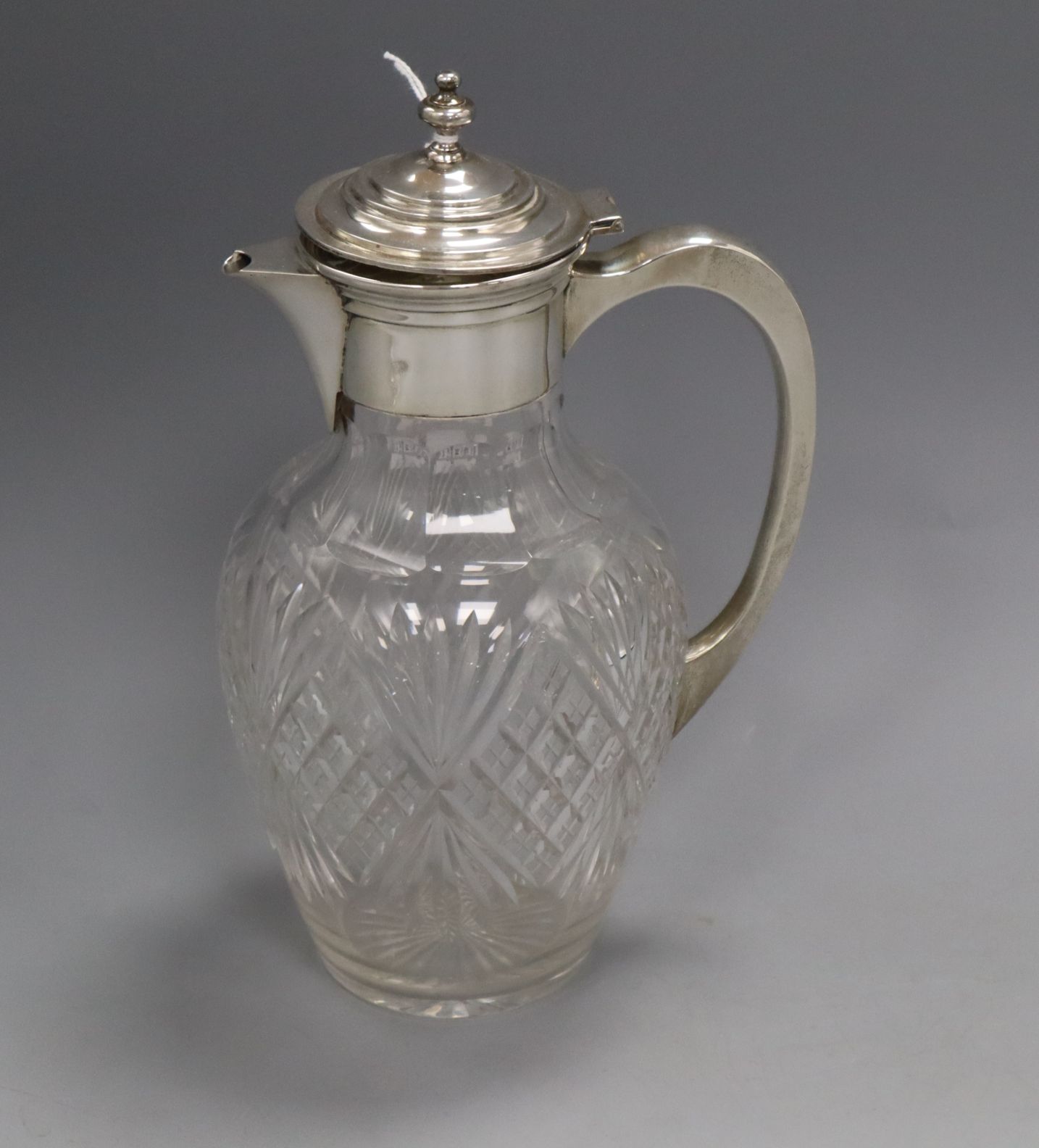 An Edwardian silver mounted cut glass claret jug, Birmingham, 1905, 24.5cm.