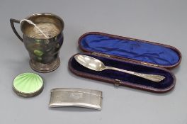 An early 20th century silver christening cup, a silver and enamel compact, silver card case and