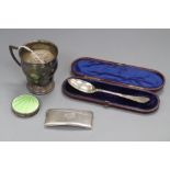 An early 20th century silver christening cup, a silver and enamel compact, silver card case and