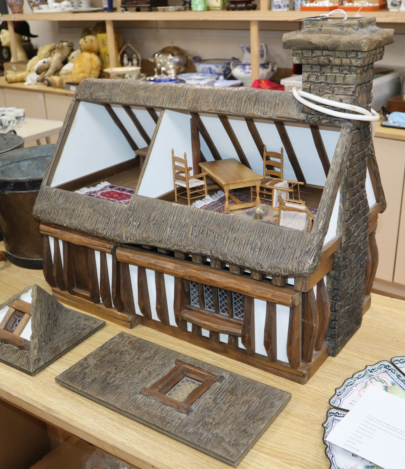 Robert Stubbs cottage style doll's house, dated 1990 - containing some furniture by Jane Norman