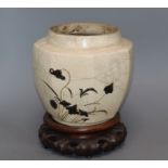 A Chinese Cizhou pottery jar, Yuan-Ming dynasty, wood stand, damaged