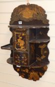 A Japanese gilt lacquered hanging wall shelves length 69cm