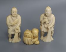 A pair of ivory okimono and a netsuke