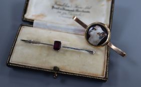 A 9ct white gold bar brooch set with an emerald-cut amethyst and a 9ct yellow gold bar brooch set
