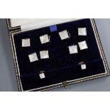 A cased 1950's eight piece 9ct gold, mother of pearl and seed pearl set dress stud set.