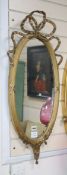 A pair of Louis XV style oval gilt framed wall mirrors H.84cm