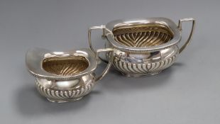 A late Victorian demi fluted silver cream jug and matching sugar bowl, William Hutton & Sons,