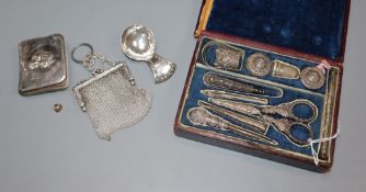 A filigree white metal-mounted sewing necessaire in fitted case and three other items, comprising