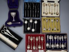 Seven cased sets/part sets of silver flatware including silver and enamel coffee spoon, a pair of