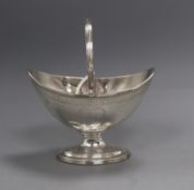 A George III silver boat shaped sugar basket, Joseph Scammell, London, 1795, height 11cm, 6 oz.