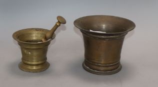 An 18th century bell metal mortar, with pestle and a similar smaller mortar