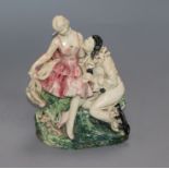 A 1920s/30s art pottery group of Pierrot and Columbine, indistinctly signed to the base, height