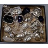 A groups of mixed white metal and mainly silver items and flatware including six condiments and