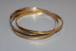 A set of three 18ct two-colour gold interlinked bangles, only one hallmarked, gross 41 grams.