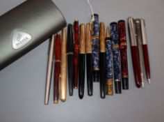 A collection of assorted Parker and other fountain and ballpoint pens and pencils