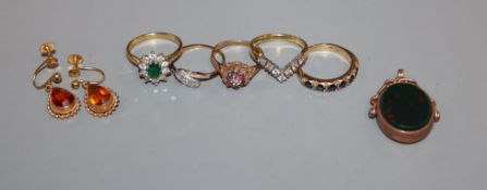 Two 18ct gold gem set rings including diamond, three 9ct gold and gem set rings, a gold fob and pair