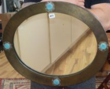 An Arts & Crafts wall mirror with Ruskin cartouches