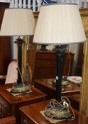A pair of Regency style bronze and brass table lamps, decorated with three griffins to the base