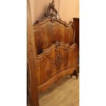 A Louis XV Design carved walnut bedframe 140cm