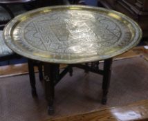 A Syrian brass top low table Diameter 70cm