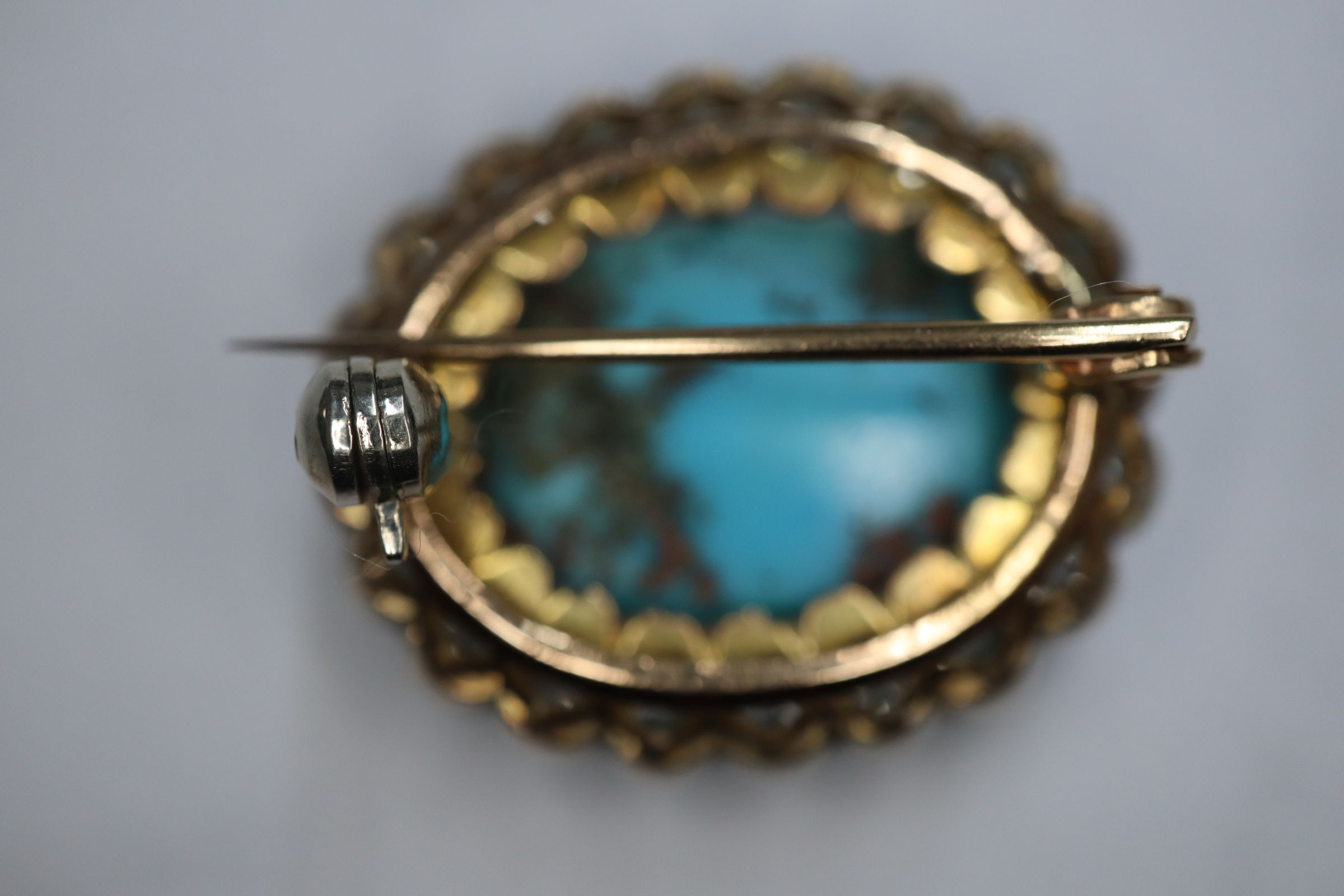 A Victorian yellow metal brooch, with oval turquoise cabochon surrounded by old-cut diamonds, 23mm. - Image 6 of 8