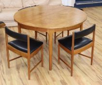 An H. McIntosh & Co Ltd circular extending dining table and four chairs, model 9533 table diameter