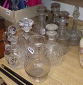 Seven cut glass decanters and a jug