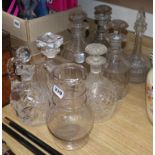 Seven cut glass decanters and a jug