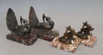 A pair of peacock bookends and similar deer bookends