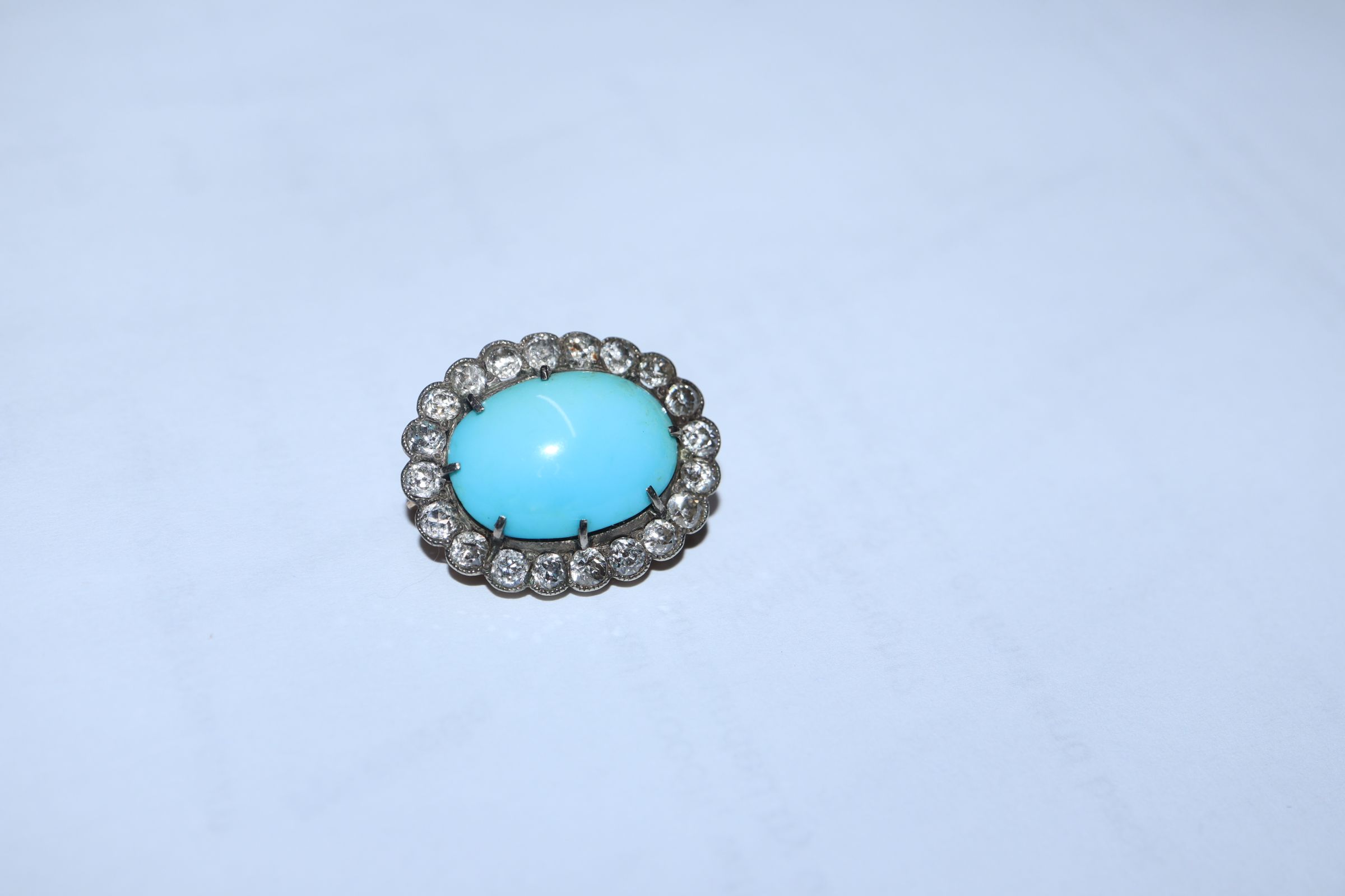 A Victorian yellow metal brooch, with oval turquoise cabochon surrounded by old-cut diamonds, 23mm. - Image 3 of 8