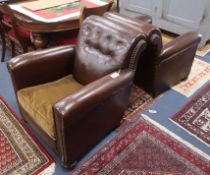 A pair of 1920's brown leather armchairs