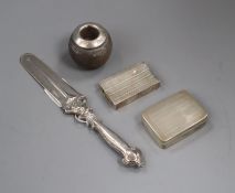 A silver mounted match strike, a silver letter knife, a white metal snuff box and a silver match box