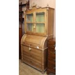 A Continental pine cylinder bureau bookcase W.103cm