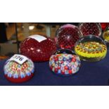 A Baccarat-style paperweight and four others