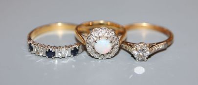 A 18ct and plat, solitaire diamond ring, an 18ct sapphire and diamond ring and a 18ct, white opal