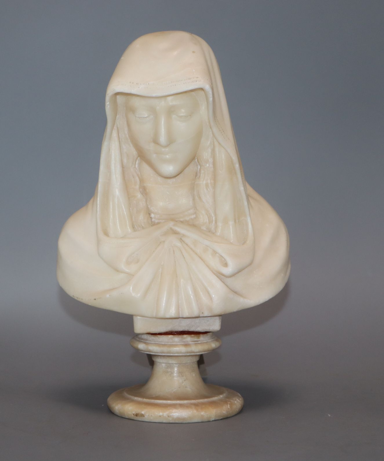 A marble bust of a Madonna height 21cm (a.f.)