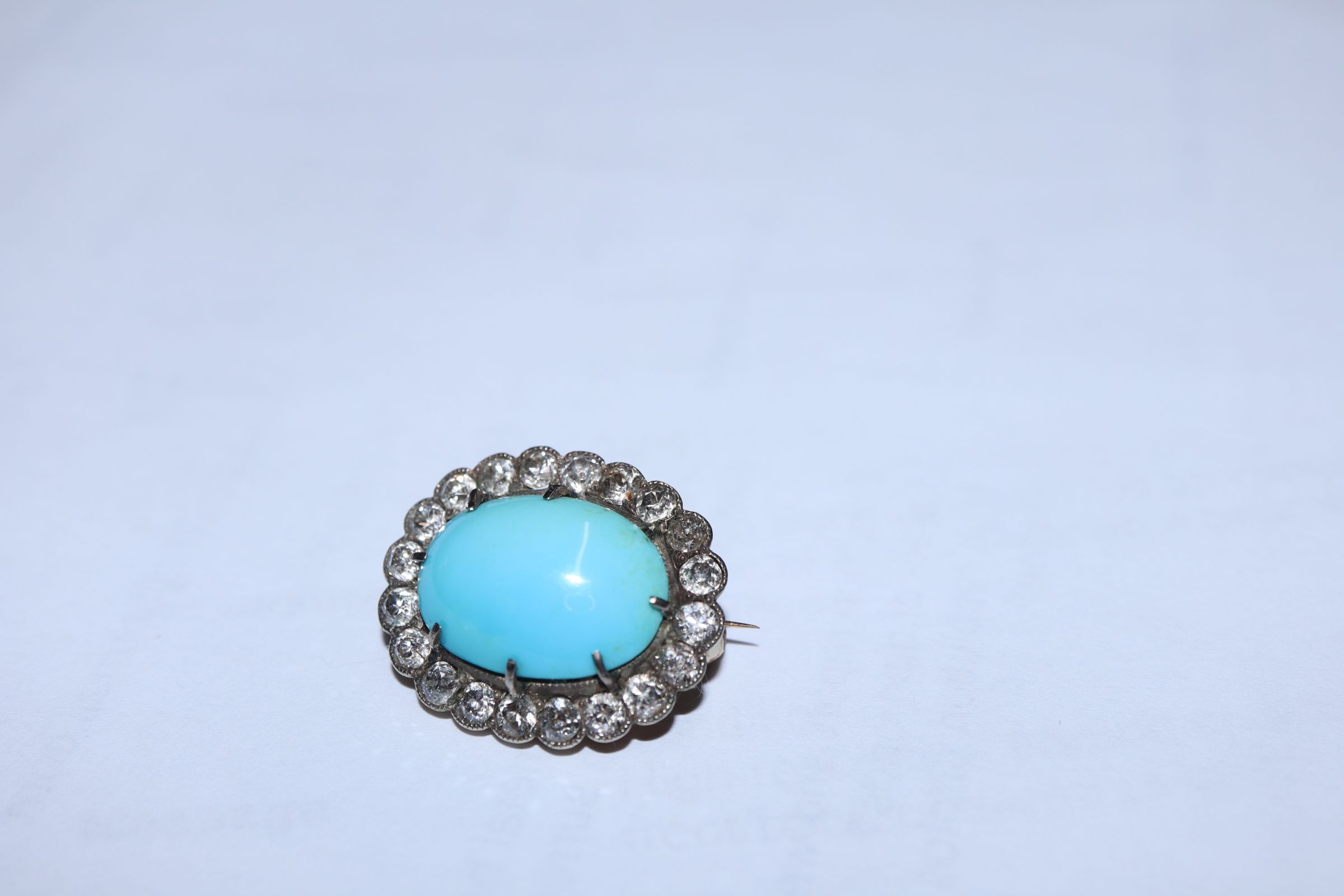 A Victorian yellow metal brooch, with oval turquoise cabochon surrounded by old-cut diamonds, 23mm. - Image 2 of 8