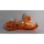 A Chinese carved chalcedony model fruit and rat