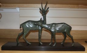 An Art Deco spelter deer group, on a black marble base length 70cm