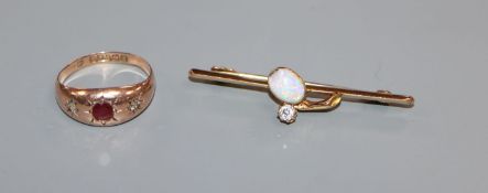 An early 20th century 15ct, white opal and diamond bar brooch and a 9ct gold gypsy set ruby and