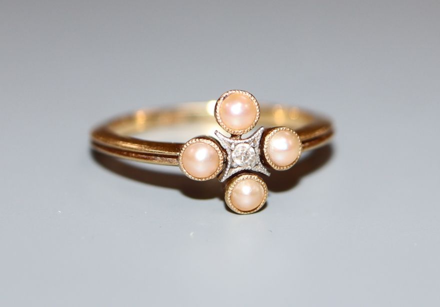 An 18ct, diamond and split pearl cluster ring, size L.