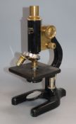 A brass mounted microscope, cased