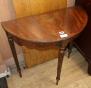 A mahogany bow front side table W.72cm