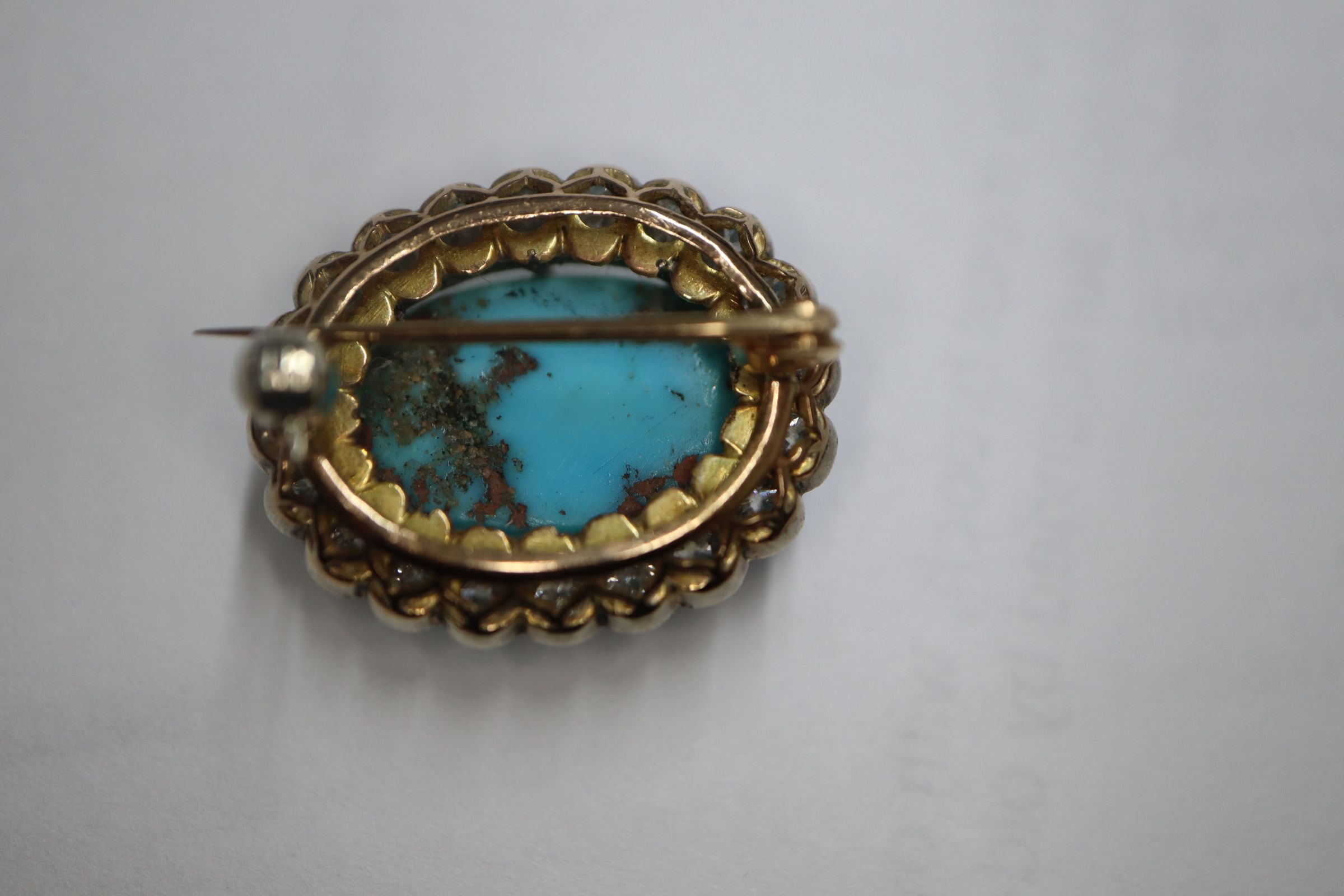 A Victorian yellow metal brooch, with oval turquoise cabochon surrounded by old-cut diamonds, 23mm. - Image 7 of 8