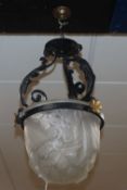 A glass and wrought iron Art Deco hanging light, signed Moyner