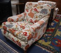 A pair of Howard style upholstered armchairs