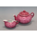 A Chinese ruby ground sgraffito 'dragon' teapot and milk jug , Republic period